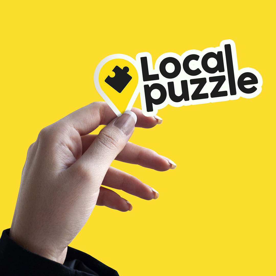 Local Puzzle Hand Holding Die Cut Sticker Mockup2 e1710783518359